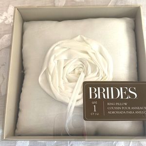 Ring pillow for a wedding by Brides with flower with ribbon white matte fabric